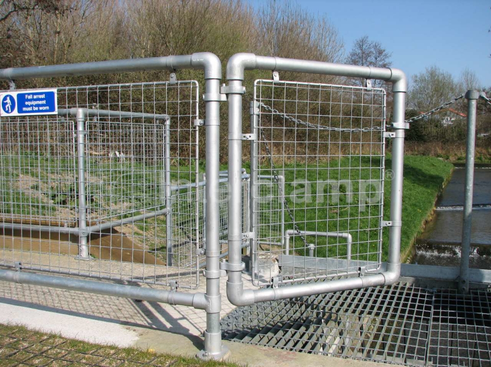 Tube clamp gate construced with Interclamp handrail fittings for access by maintenance personnel